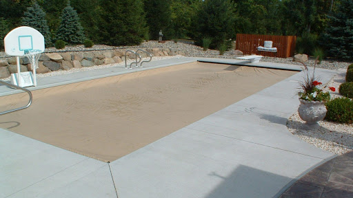a winter safety pool cover over a pool