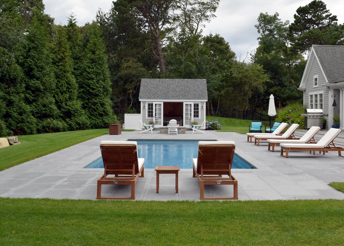 cloudy sky and empty pool are signs it's time to winterize your pool